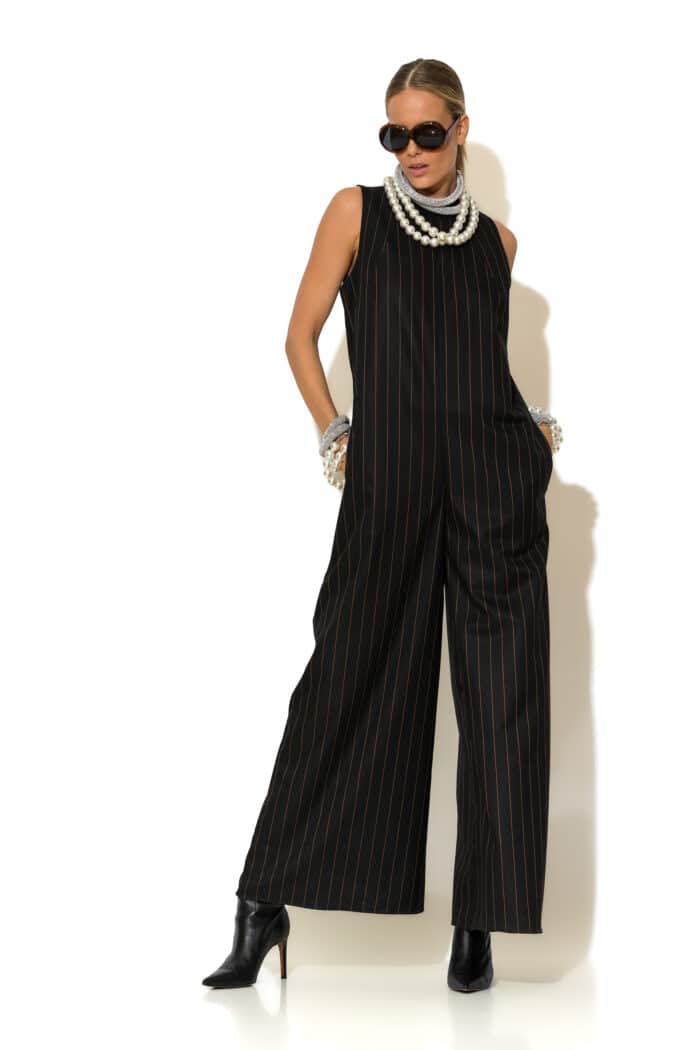 A versatile woven striped jumpsuit with a relaxed fit, elevated by the Signature C logo near the waist. Perfect for effortless day-to-evening style.