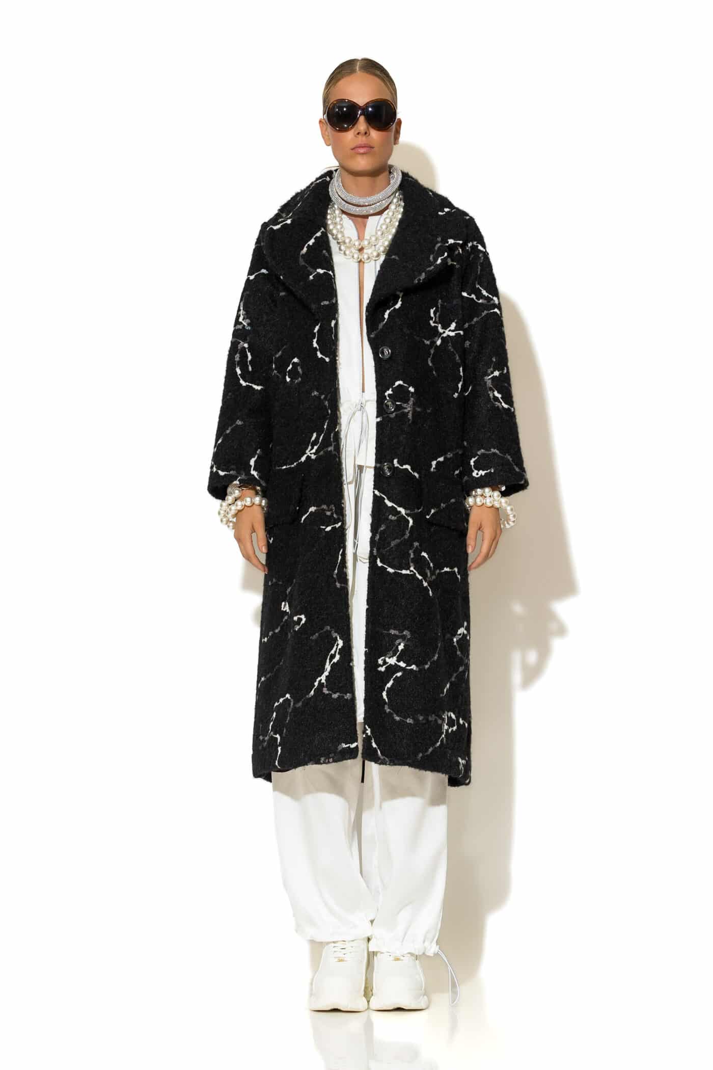 Women's long black bouclé jacquard coat – front view with buttons and flap pockets