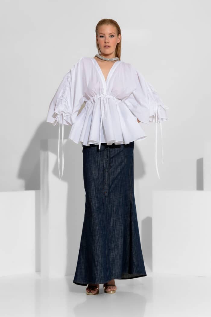 Discover our Button-Down Mermaid Maxi Denim Skirt. Featuring a bold front slit, 5-pocket design, and slightly low-waisted fit. 100% Cotton Denim. Made in Greece