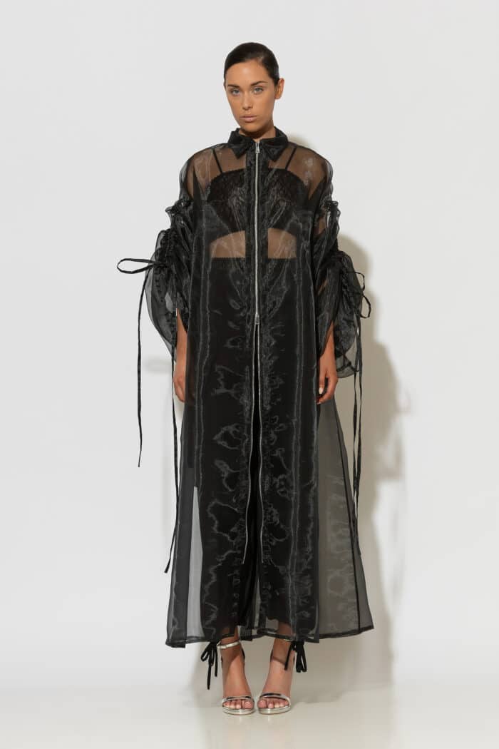 C-THROU black sheer organza coat with voluminous drawstring sleeves and longline silhouette.