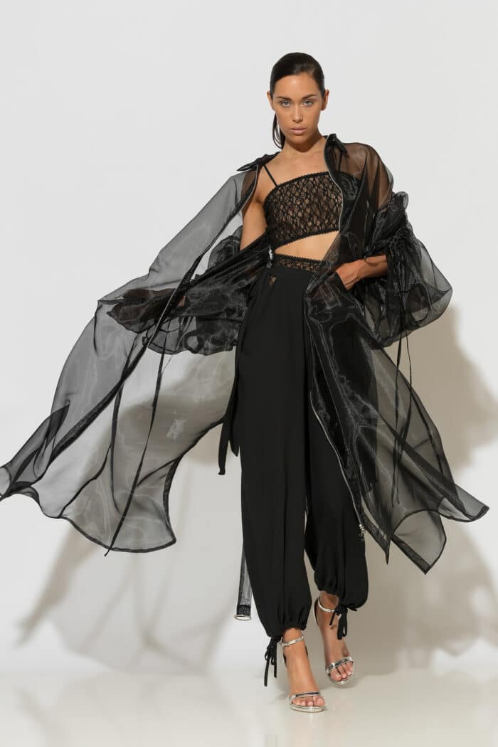 C-THROU black sheer organza coat with voluminous drawstring sleeves and longline silhouette.