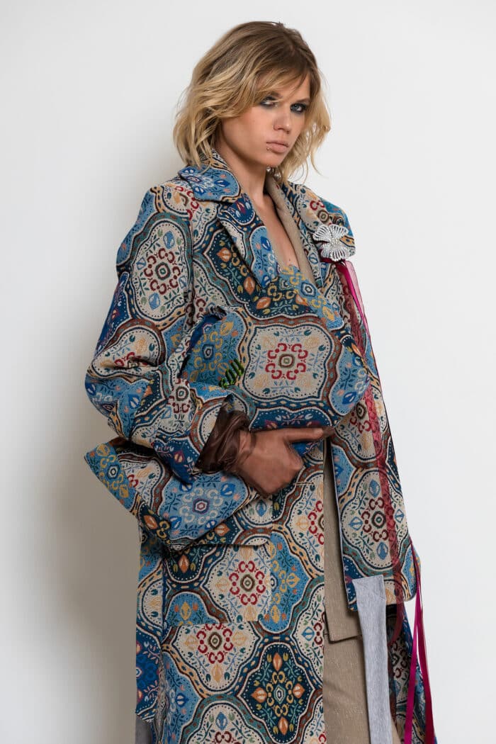 Multicolour brocade medium tote bag with ornate blue and turquoise pattern, matching handles and green embroidered logo.